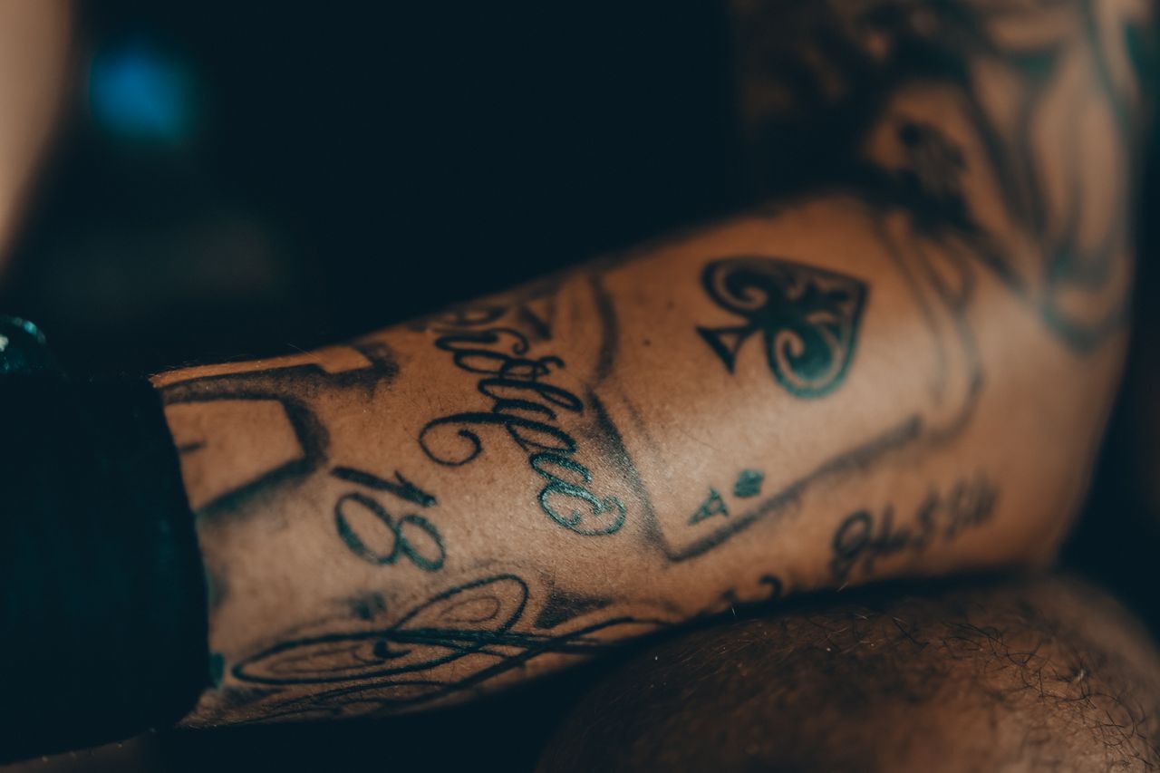 services-02 Detailed view of an intricate tattoo on a forearm, showcasing artistic design.